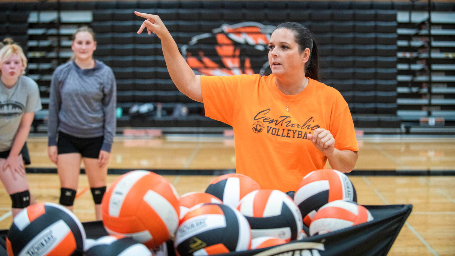 Marti Smith, volleyball coach at Centralia High School, points and directs athletes during practice Friday afternoon.